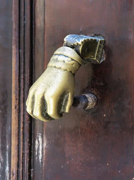 Brass knocker in the shape of your hand — Stock Photo, Image