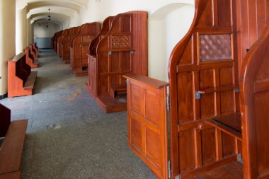 Empty confessionals, a place of repentance and conversion. Inter clipart