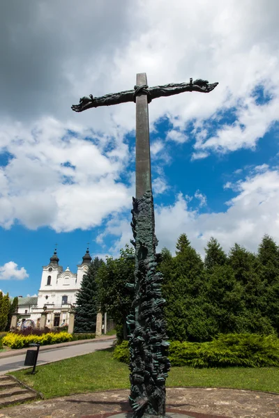 Dukla, Poland - July 22, 2016: Cross reconciliation entwined hands pleading wreath consecrated by Pope John Paul II — Stock Photo, Image