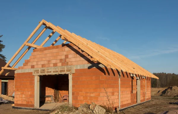 Construction of a small, simple residential building. Raw state with a roof truss.