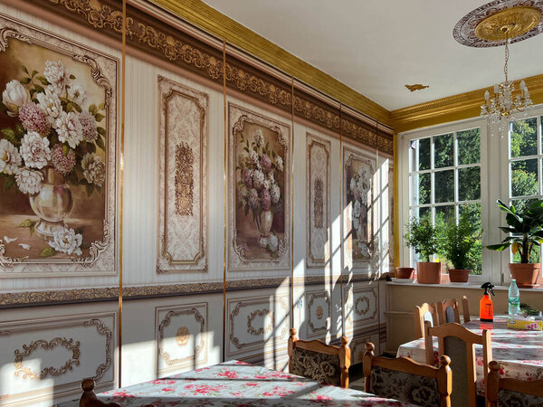 Duszniki Zdroj, Poland, September 4, 2025: Franciscan Monastery in Duszniki Zdroj, Poland. Dining room with floral wallpaper on the walls.