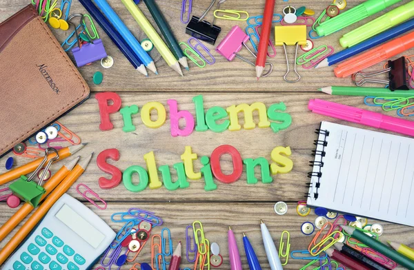 Problems Solutions words and office tools on wooden table — Stock Photo, Image