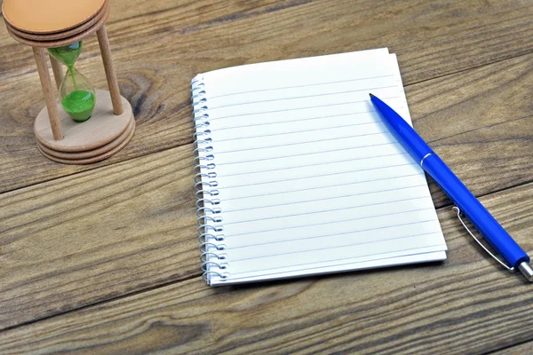 White notebook on wooden table — Stock Photo, Image