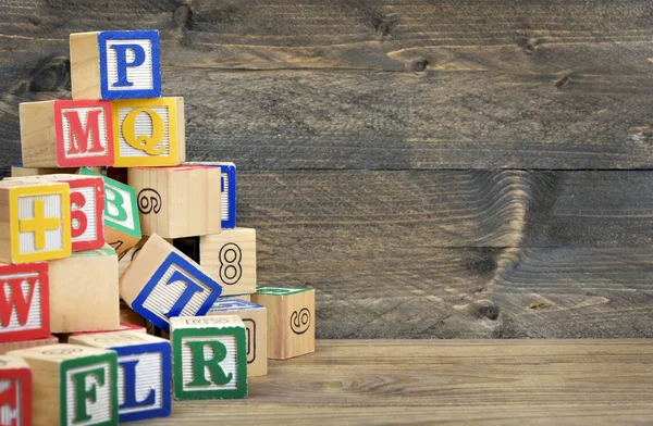 Block letters on table — Stock Photo, Image