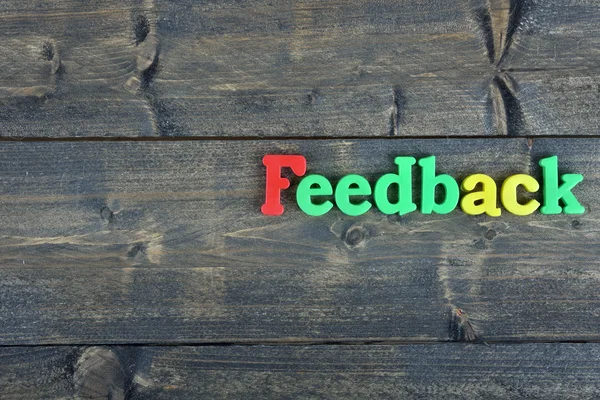 Feedback em mesa de madeira — Fotografia de Stock