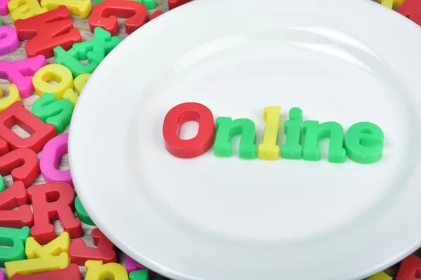 Online word on plate — Stock Photo, Image