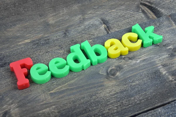 Feedback em mesa de madeira — Fotografia de Stock