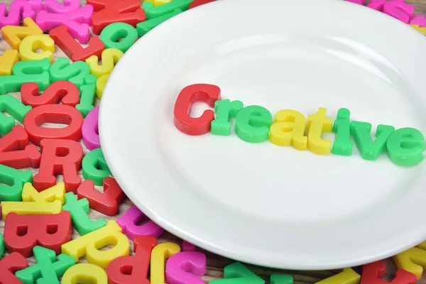 Creative word on plate — Stock Photo, Image