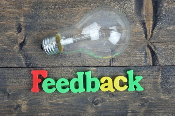 Feedback em mesa de madeira — Fotografia de Stock