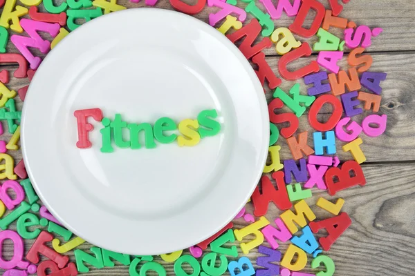 Słowo fitness na talerzu — Zdjęcie stockowe