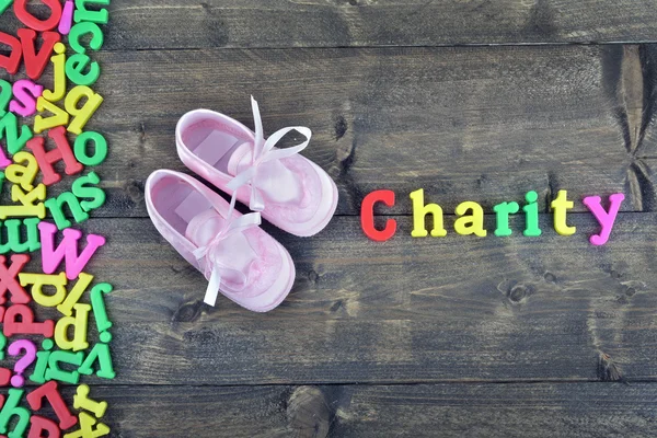 Charity on wooden table — Stock Photo, Image