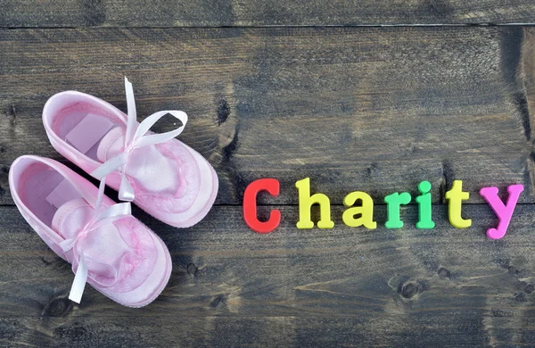 Charity on wooden table — Stock Photo, Image