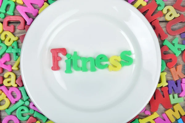 Słowo fitness na talerzu — Zdjęcie stockowe