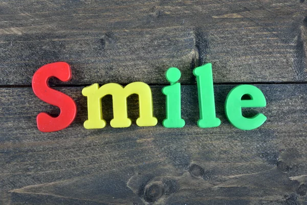 Smile on wooden table — Stock Photo, Image