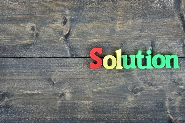 Solution sur table en bois — Photo