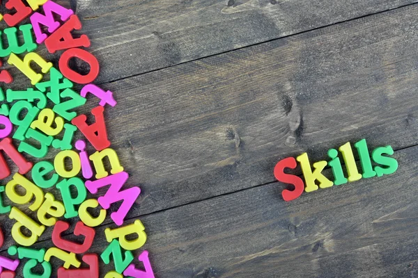 Skills on wooden table — Stock Photo, Image