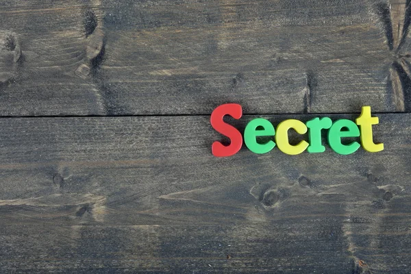 Secret on wooden table — Stock Photo, Image