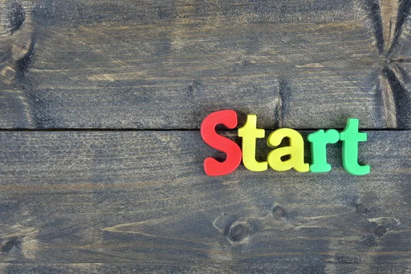 Start op houten tafel — Stockfoto