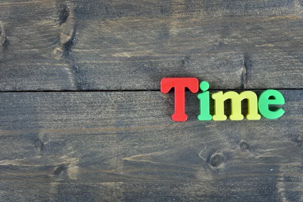 Time on wooden table — Stock Photo, Image