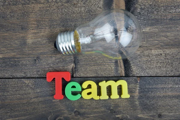 Team on wooden table — Stock Photo, Image