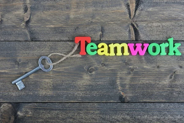 Team on wooden table — Stock Photo, Image