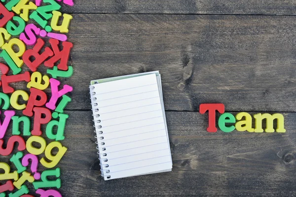 Team on wooden table — Stock Photo, Image