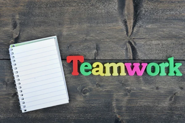 Team on wooden table — Stock Photo, Image