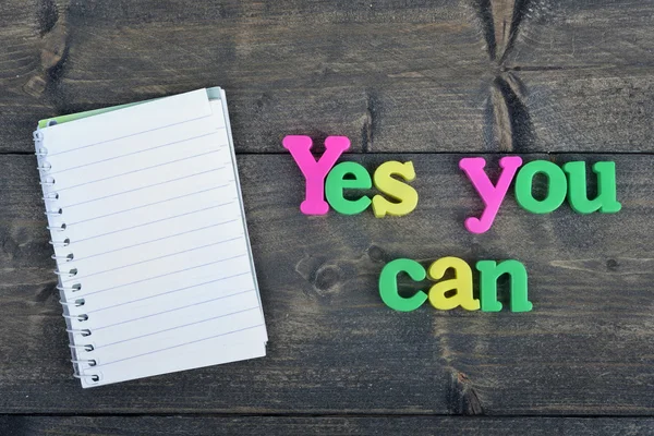 Yes you can on wooden table — Stock Photo, Image
