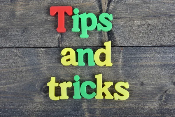Tips and tricks on wooden table — Stock Photo, Image