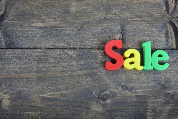 Sale on wooden table — Stock Photo, Image