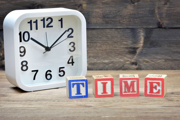 Klocka och ordet tid — Stockfoto