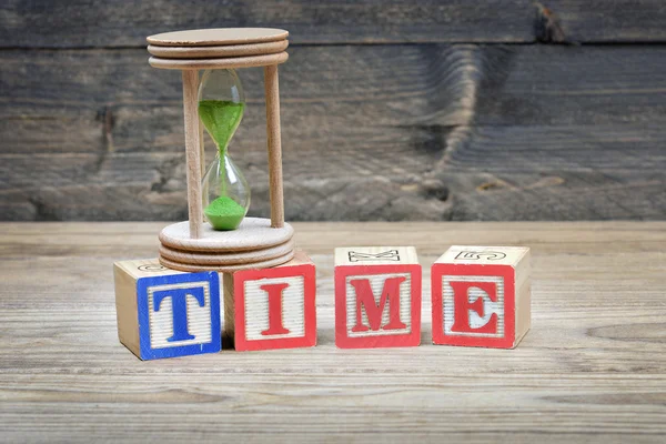 Timglas och ordet tid — Stockfoto