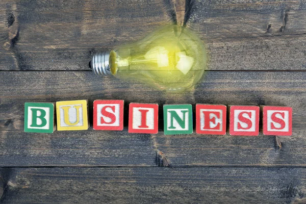 Glödlampa och word Business — Stockfoto