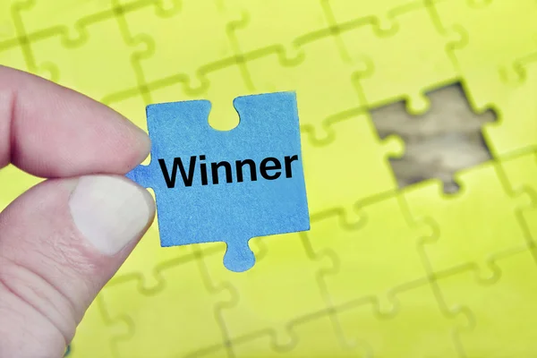Puzzel met woord winnaar — Stockfoto