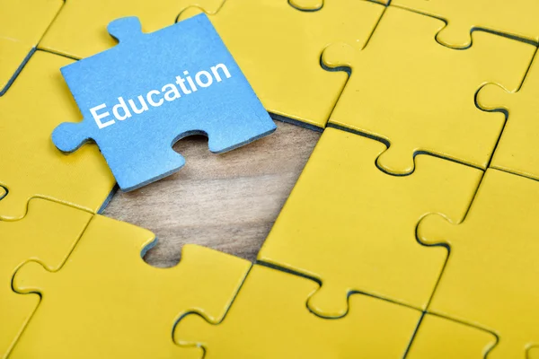 Puzzle with word Education — Stock Photo, Image