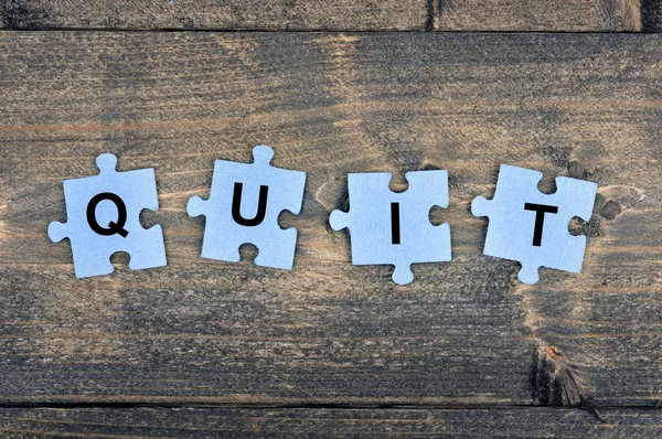 Puzzle with word Quit — Stock Photo, Image