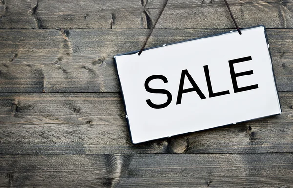 Sale on wooden table — Stock Photo, Image