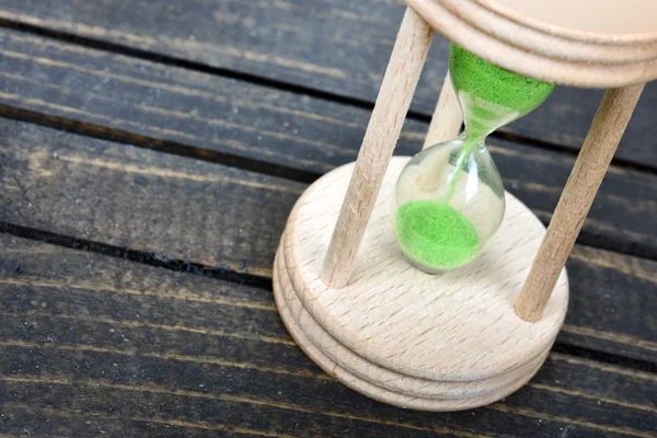 Hourglass on table — Stock Photo, Image