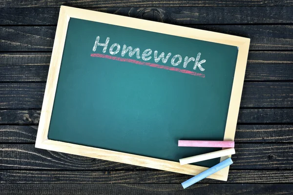 Huiswerk tekst op schoolbestuur — Stockfoto