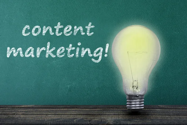 Content marketing text and light bulb on table