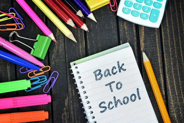 Back to school text on notepad and office tools — Stock Photo, Image