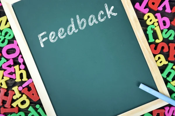 Texto de feedback no quadro da escola — Fotografia de Stock