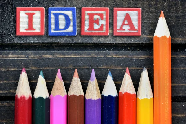 Idea text and group of pencil on table — Stock Photo, Image