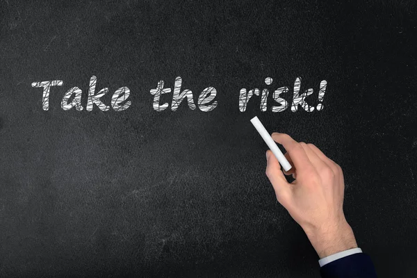 Take the risk text on black board — Stock Photo, Image