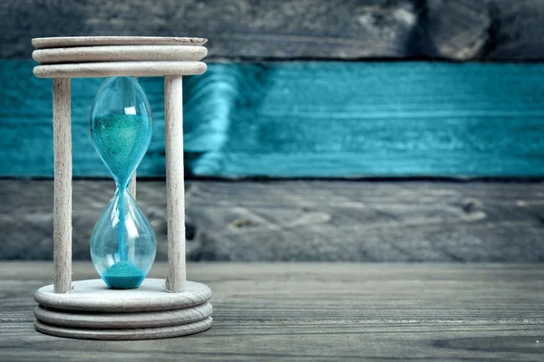 Hourglass on table — Stock Photo, Image