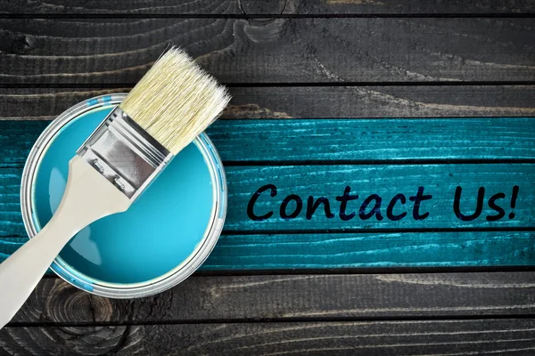Contact Us message and paintbrush on table — Stock Photo, Image