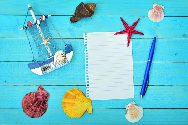 Toy ship and notepad — Stock Photo, Image