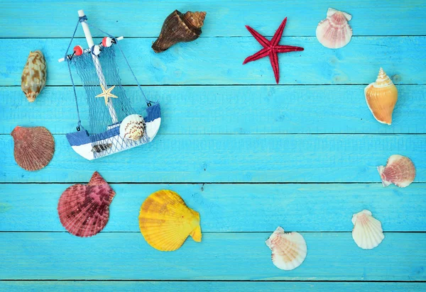 Toy ship and sea shells — Stock Photo, Image