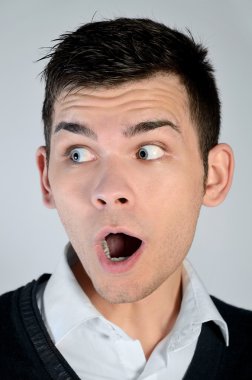 Young man amazed face