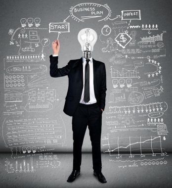 Business man writing business plan